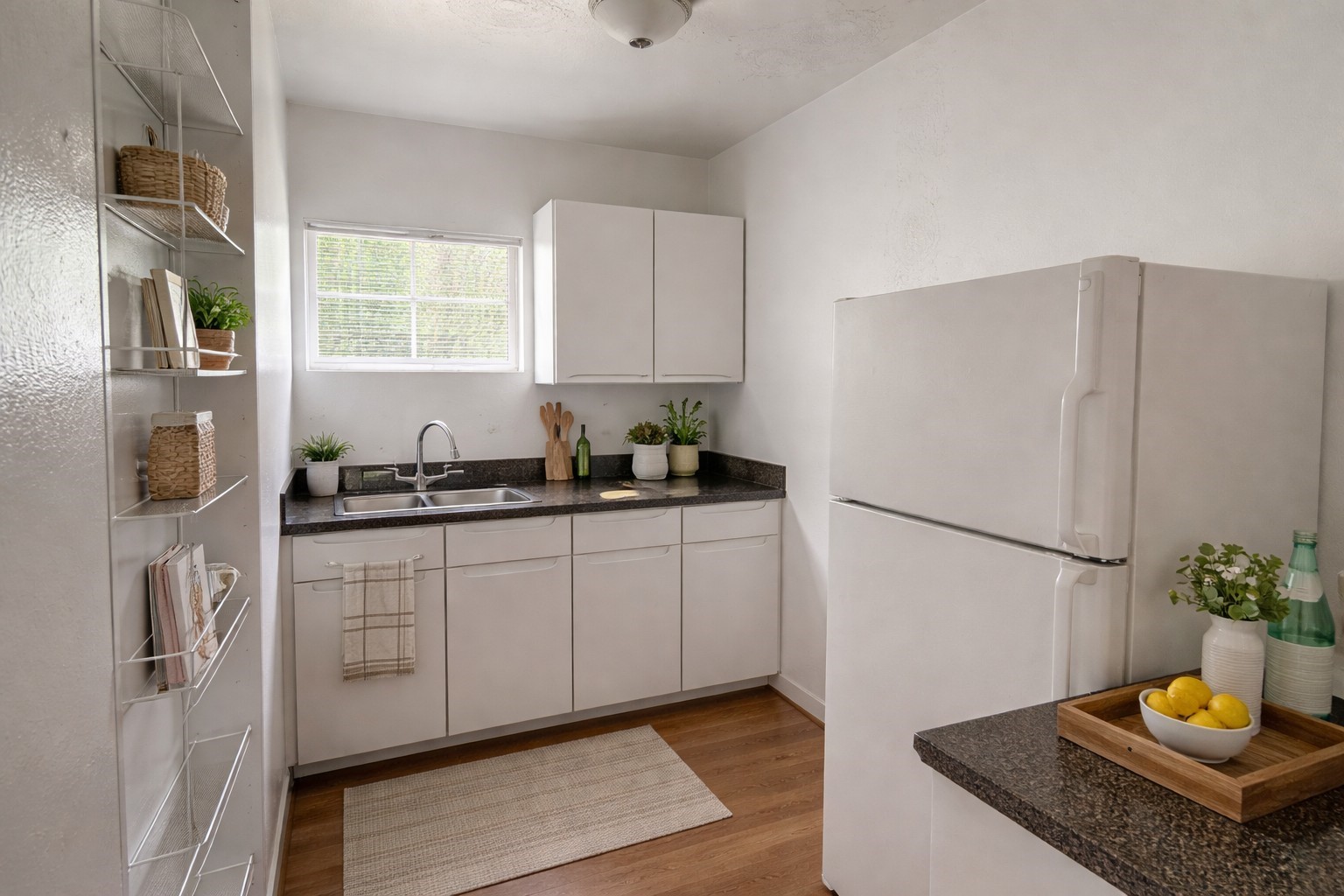 5611 Jackson Street, Unit 11 Houston, TX 77004 - Photo 2 of 7 a kitchen with stainless steel appliances granite countertop a refrigerator sink and white cabinets
