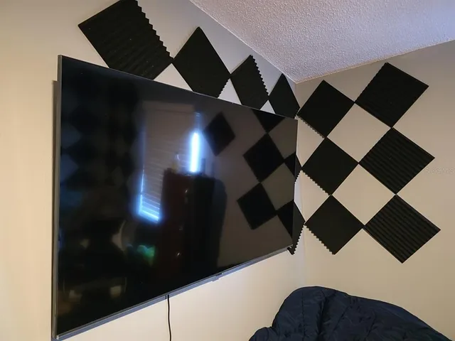 a balcony with black and white checkered floor