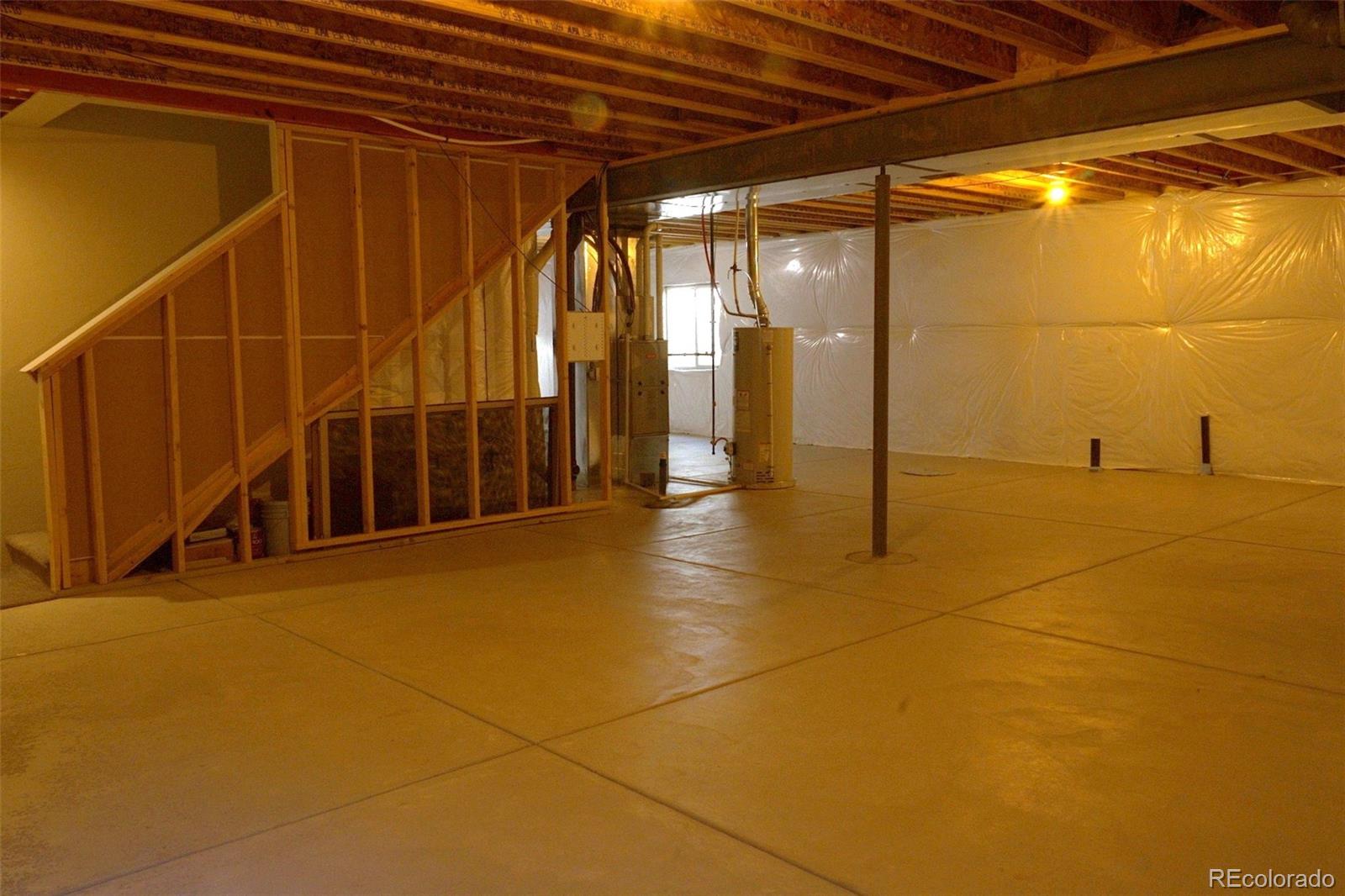 1113 Bison Way Wiggins, CO 80654 - Photo 13 of 20 a view of an empty room with glass door