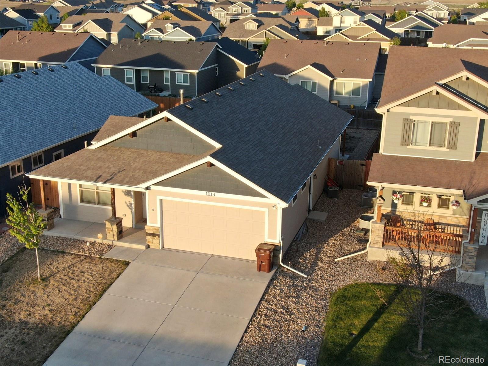 1113 Bison Way Wiggins, CO 80654 - Photo 3 of 20 an aerial view of a house with a yard