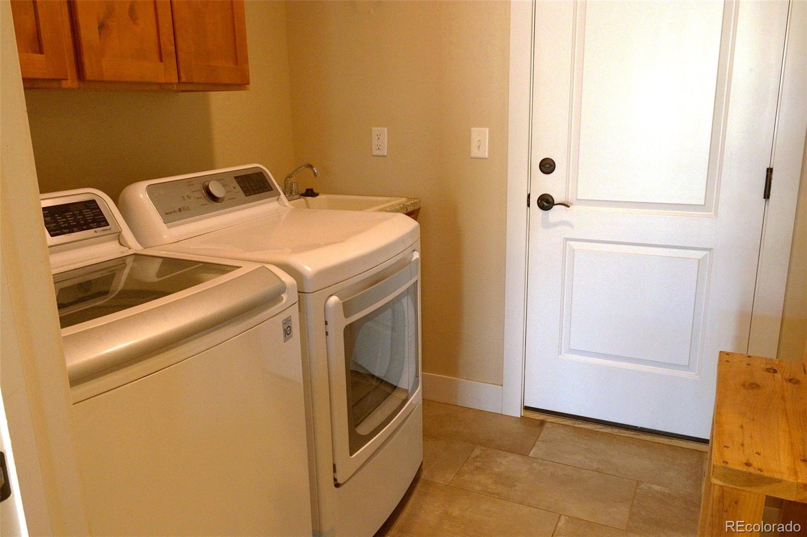 1113 Bison Way Wiggins, CO 80654 - Photo 6 of 20 a utility room with dryer and washer