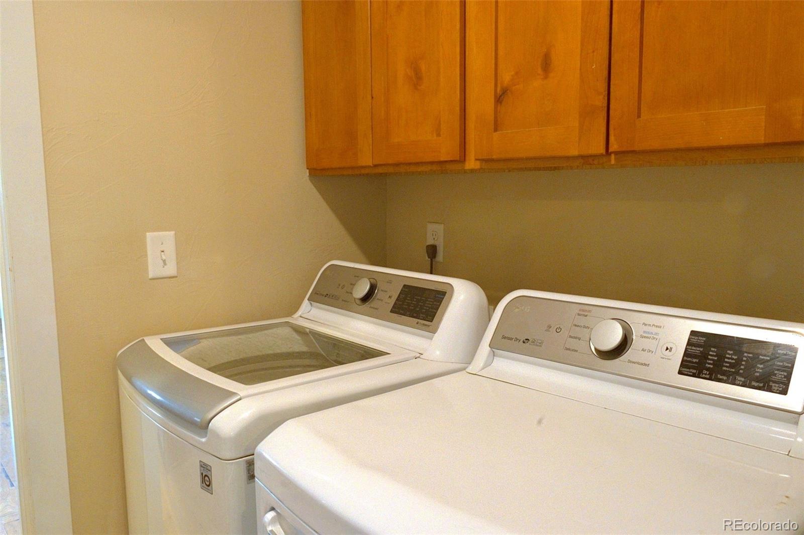 1113 Bison Way Wiggins, CO 80654 - Photo 7 of 20 a utility room with dryer and washer