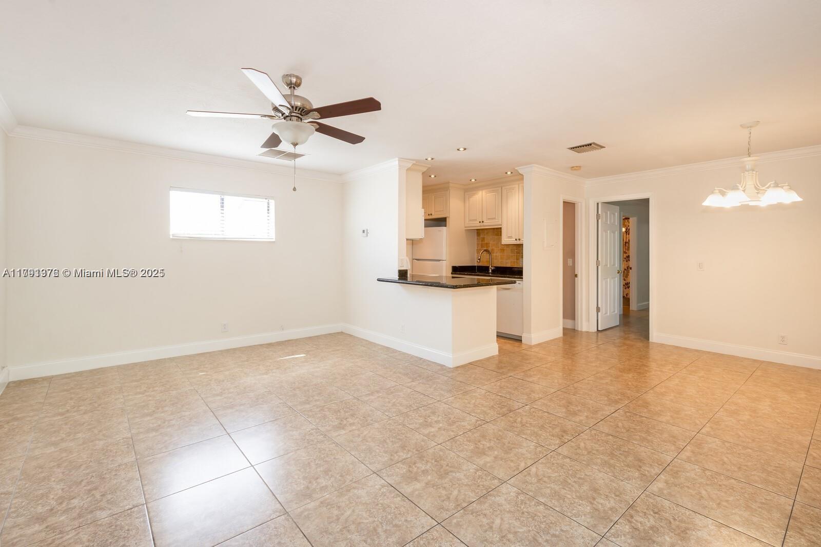 1 Crossings Circle, Unit E Boynton Beach, FL 33435 - Photo 11 of 14 a view of a kitchen with a sink and a cabinets