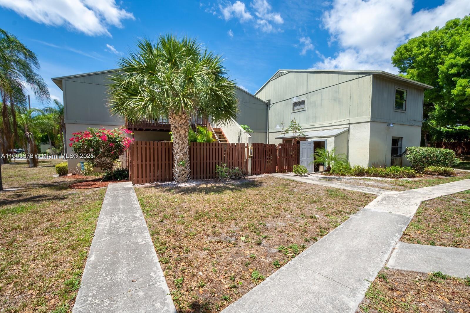 1 Crossings Circle, Unit E Boynton Beach, FL 33435 - Photo 13 of 14 a view of a house with a yard