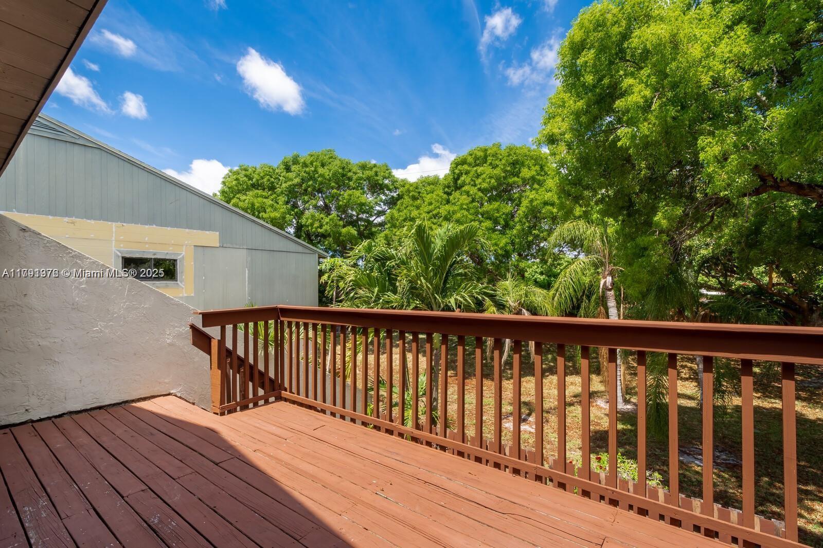 1 Crossings Circle, Unit E Boynton Beach, FL 33435 - Photo 14 of 14 a balcony with wooden floor