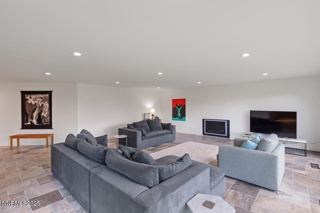 4811 Lakeridge Terrace West Reno, NV 89509 - Photo 12 of 43 a living room with furniture and a flat screen tv