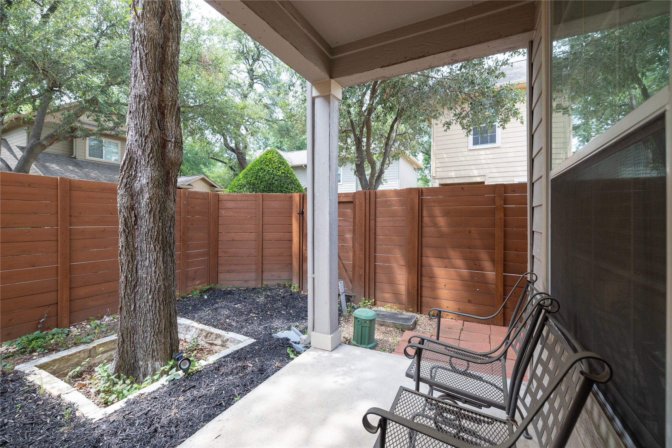 11000 Anderson Mill Road, Unit 45 Austin, TX 78750 - Photo 24 of 32 a view of a porch with chairs and backyard