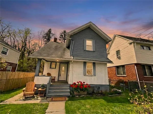 a front view of a house with garden