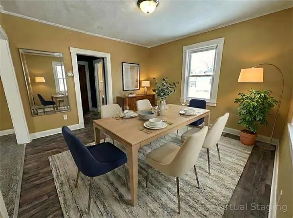 a view of a dining room with furniture and window