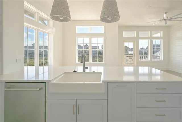 a bathroom with a sink and a large window