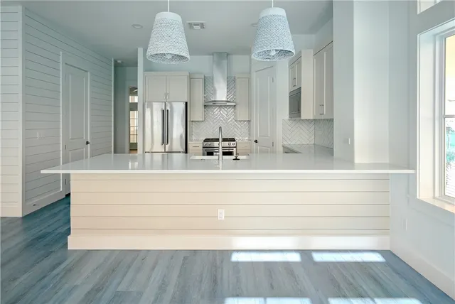 a bathroom with a sink mirror and vanity