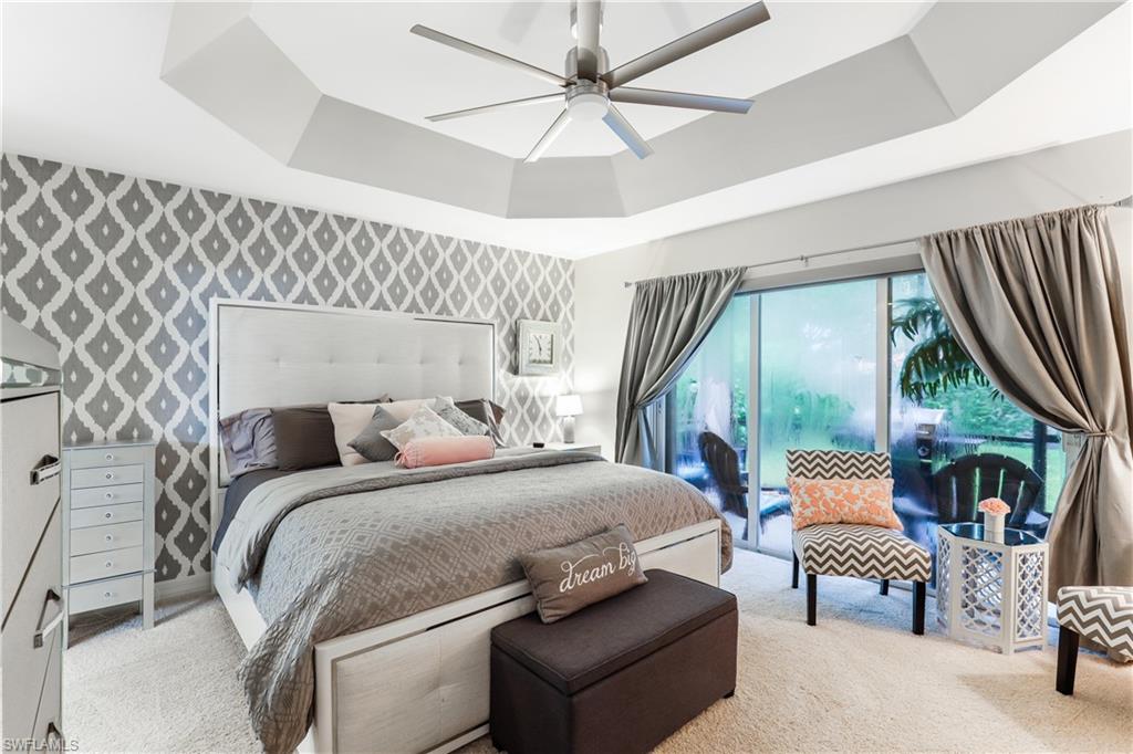 1655 Triangle Palm Terrace Naples, FL 34119 - Photo 11 of 22 a bedroom with furniture and a large window