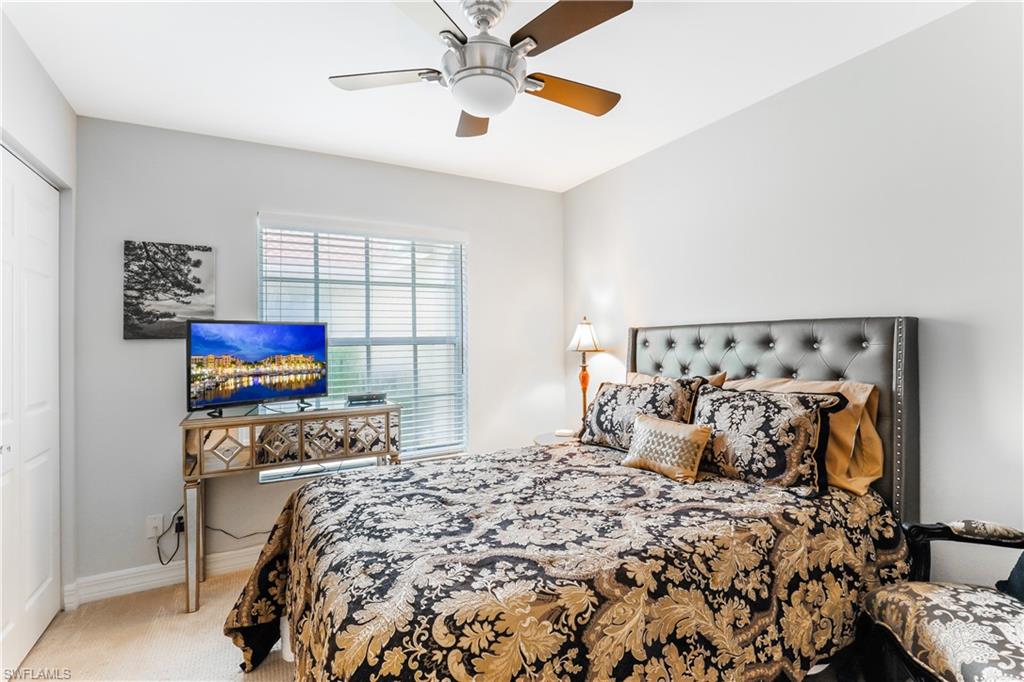 1655 Triangle Palm Terrace Naples, FL 34119 - Photo 13 of 22 a bedroom with bed and a window