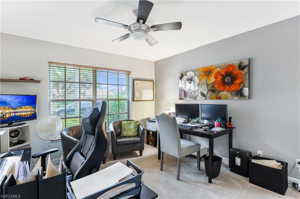 1655 Triangle Palm Terrace Naples, FL 34119 - Photo 16 of 22 a view of a workspace with furniture and a window