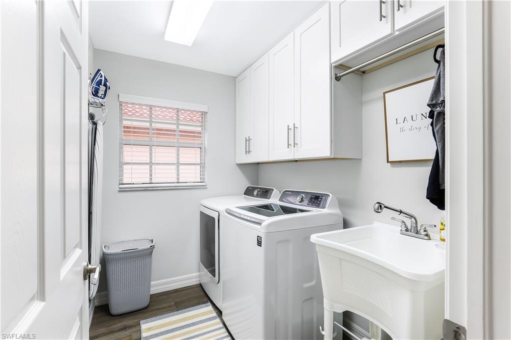 1655 Triangle Palm Terrace Naples, FL 34119 - Photo 17 of 22 a view of storage and utility room with a washer and dryer