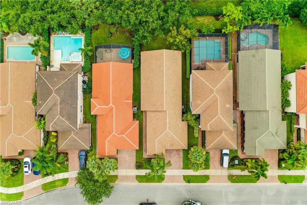1655 Triangle Palm Terrace Naples, FL 34119 - Photo 19 of 22 aerial view of a house with a yard and plants