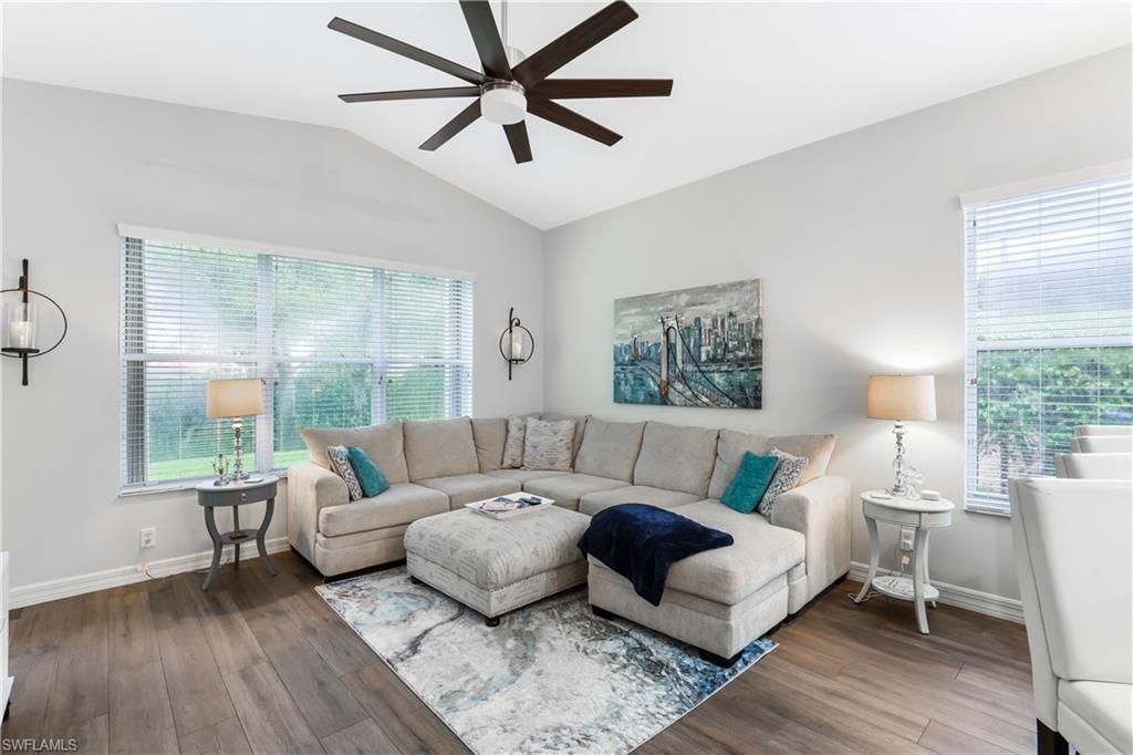 1655 Triangle Palm Terrace Naples, FL 34119 - Photo 9 of 22 a living room with furniture and a large window