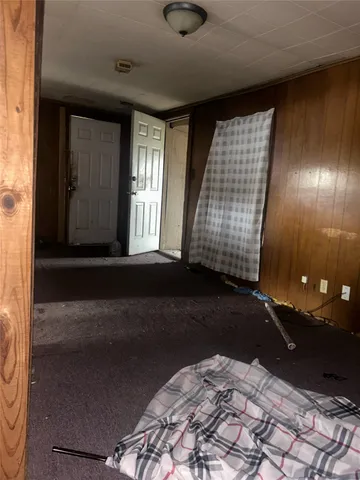 an empty room with wooden floor