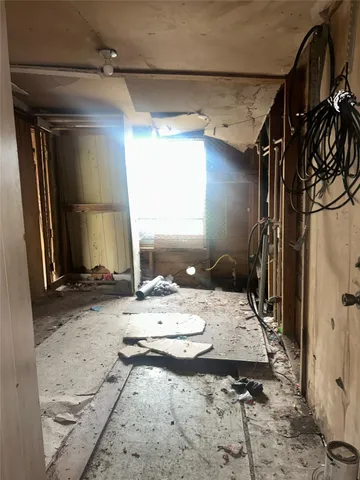 a bathroom with a granite countertop sink a mirror and shower