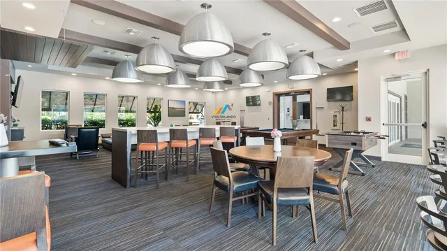 a view of a dining area with furniture and wooden floor