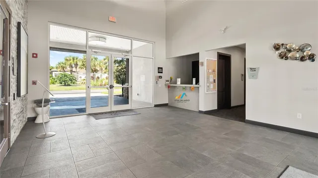 a view of livingroom with furniture and floor to ceiling window