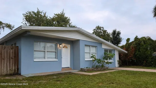 a view of house with roof deck