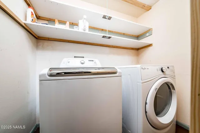 a bedroom with a bed and a mirror on dresser