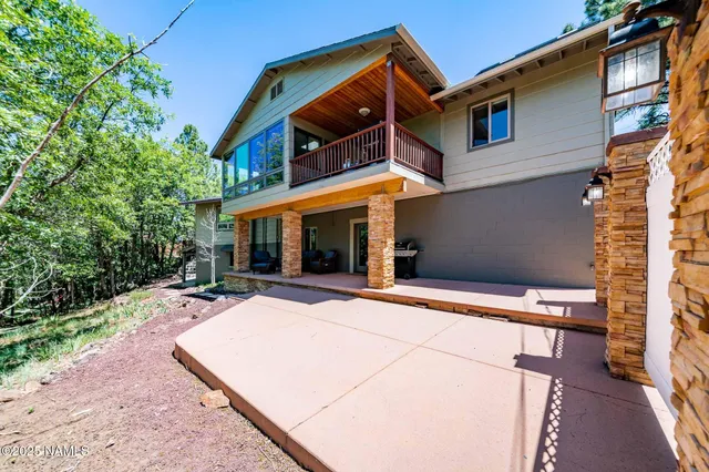 a living room with furniture a rug and a flat screen tv