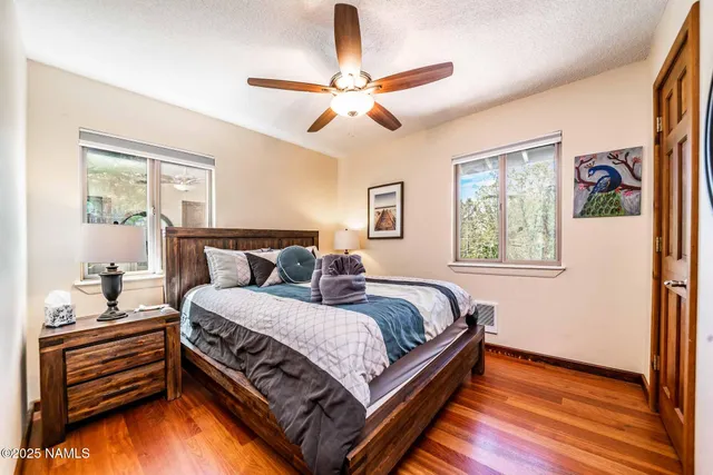 a bed sitting in a bedroom next to a window