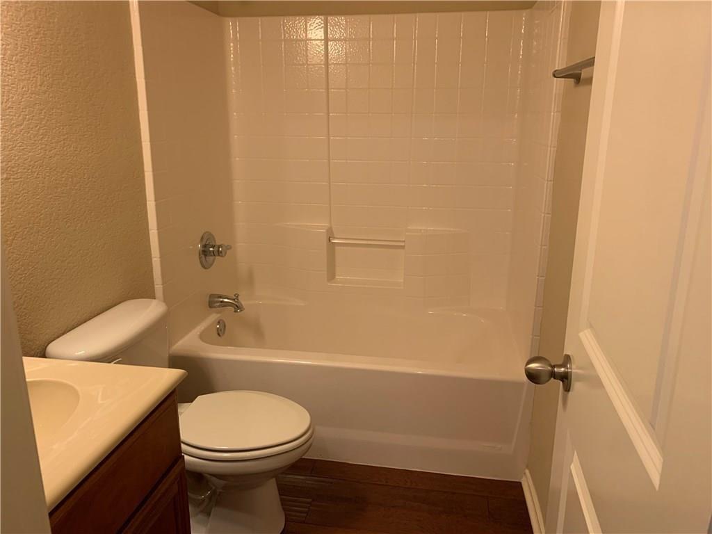 129 Sierra Drive Waxahachie, TX 75167 - Photo 12 of 24 a bathroom with a sink a toilet and shower