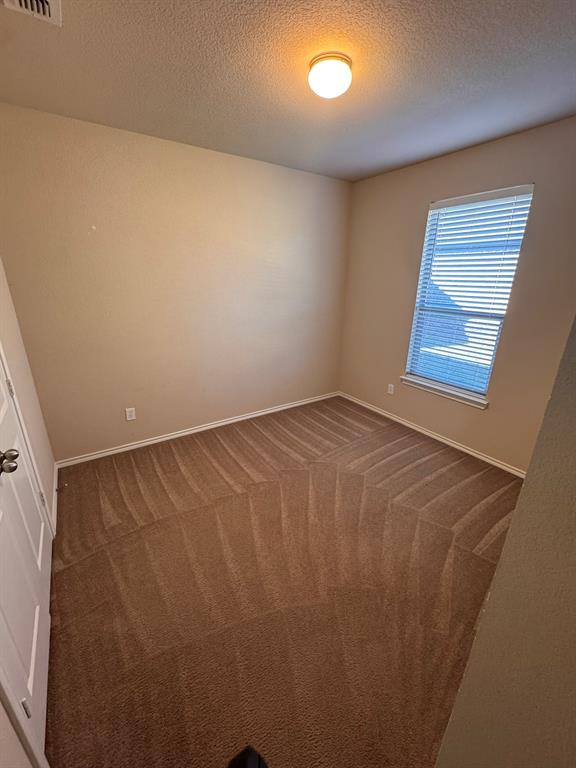 129 Sierra Drive Waxahachie, TX 75167 - Photo 14 of 24 an empty room with windows
