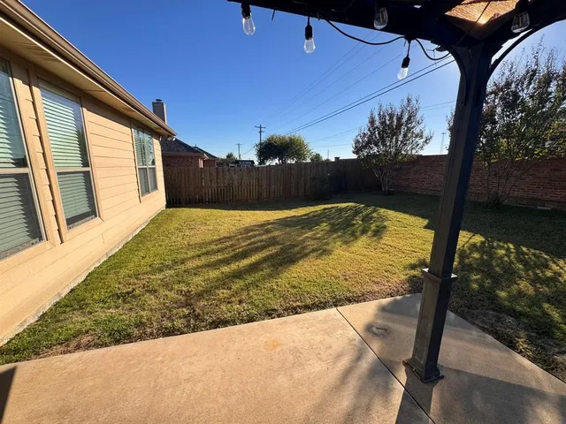 a view of swimming pool with patio