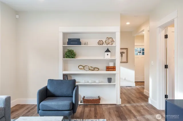 a living room with a couch and a rug