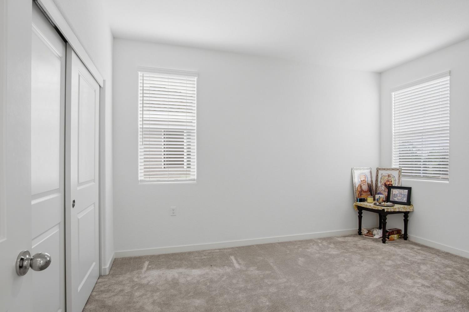 5520 Cora Way Keyes, CA 95328 - Photo 15 of 28 an empty room with windows