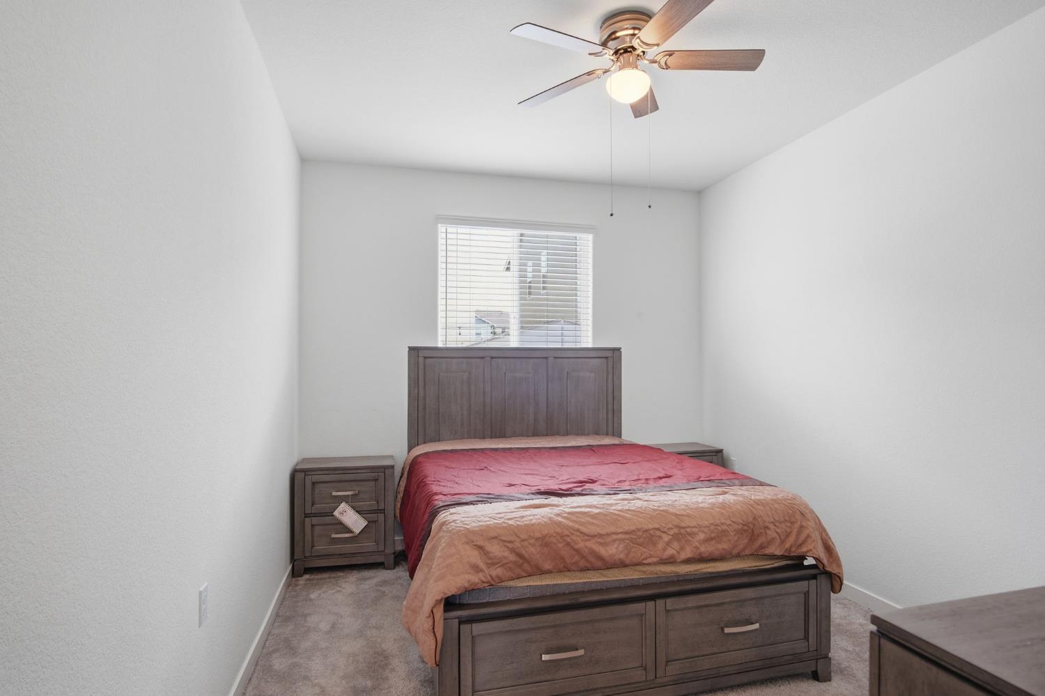 5520 Cora Way Keyes, CA 95328 - Photo 17 of 28 a bedroom with a bed and a window