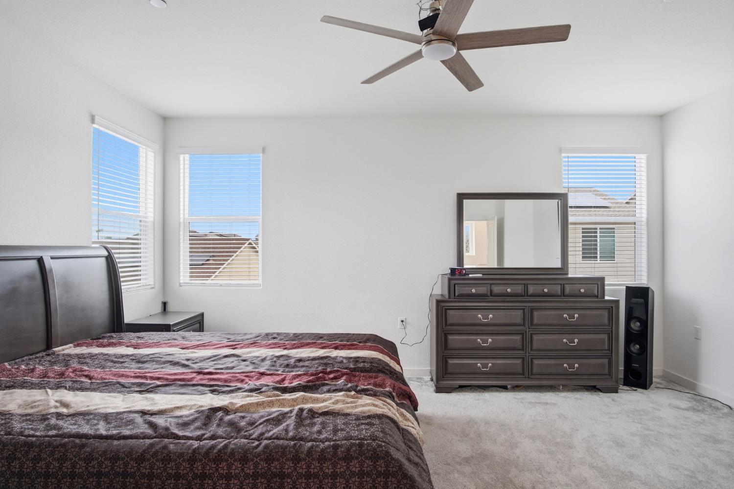 5520 Cora Way Keyes, CA 95328 - Photo 20 of 28 a bedroom with a bed and a window