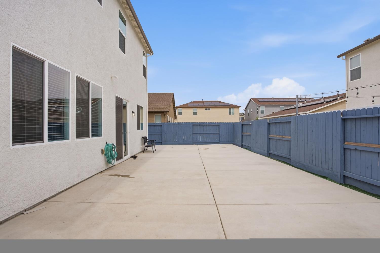 5520 Cora Way Keyes, CA 95328 - Photo 23 of 28 a view of a house with a wooden bench