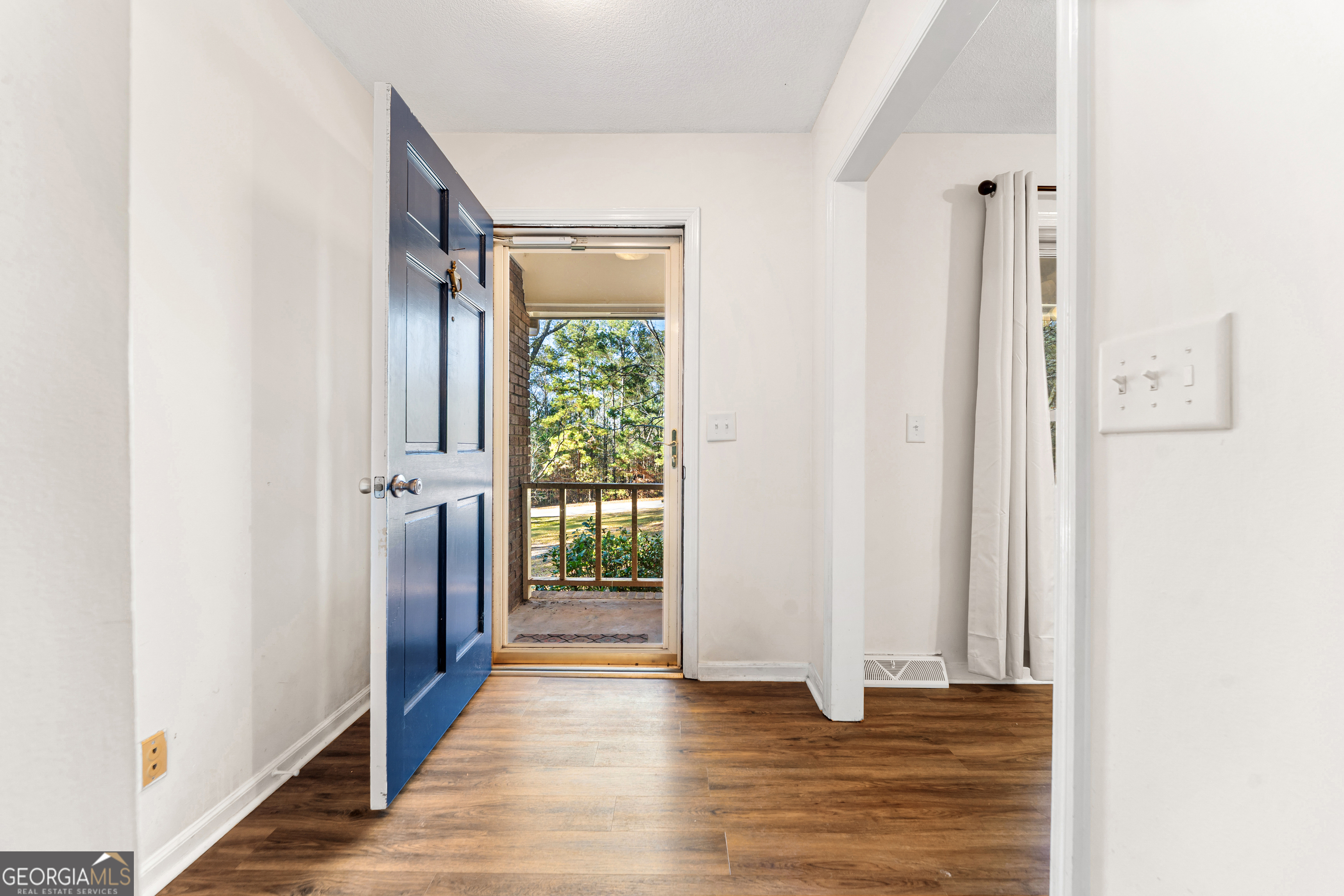 101 Fisher Drive Hartwell, GA 30643 - Photo 12 of 48 a view of a hallway with wooden floor and closet
