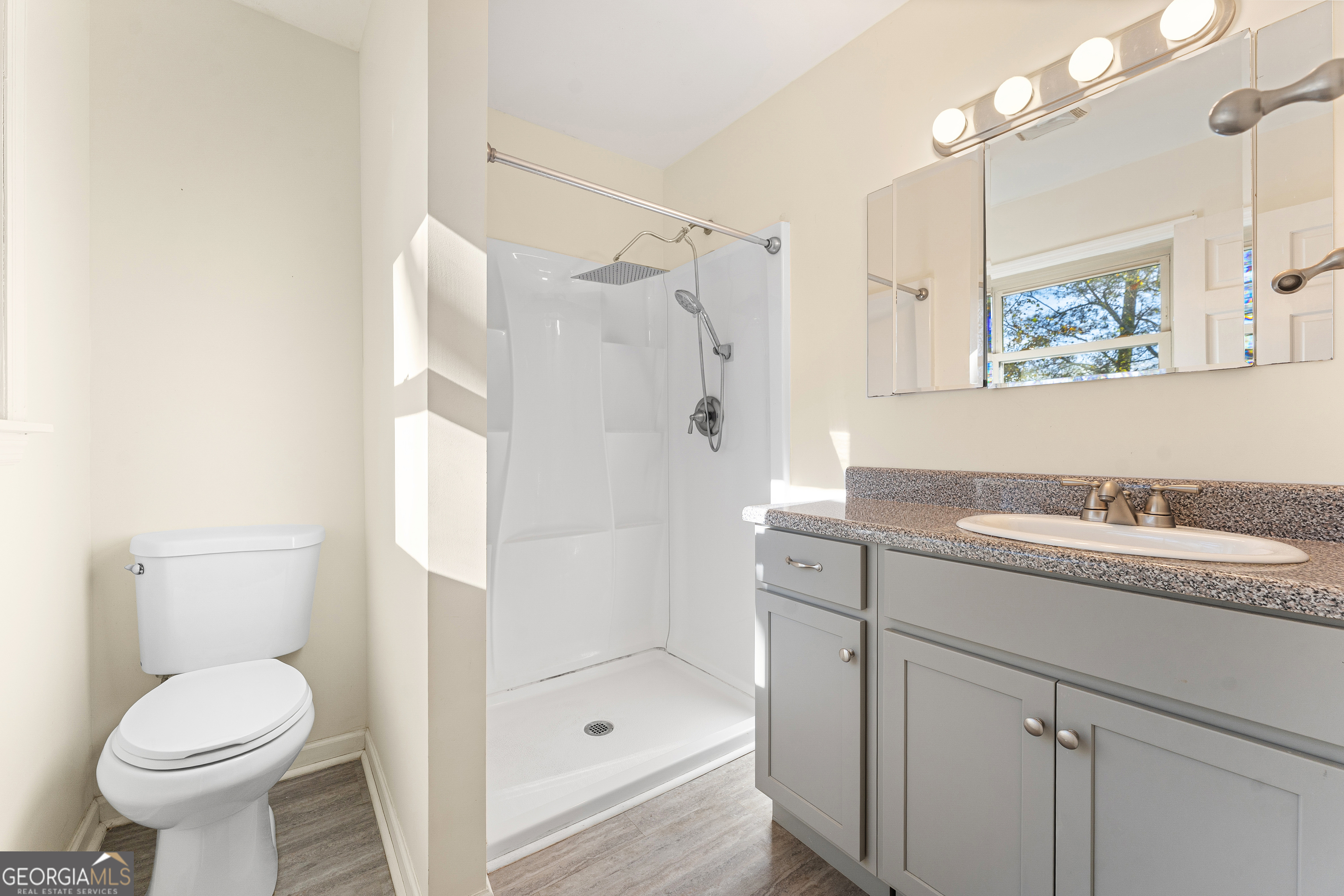 101 Fisher Drive Hartwell, GA 30643 - Photo 14 of 48 a bathroom with a granite countertop sink toilet and shower
