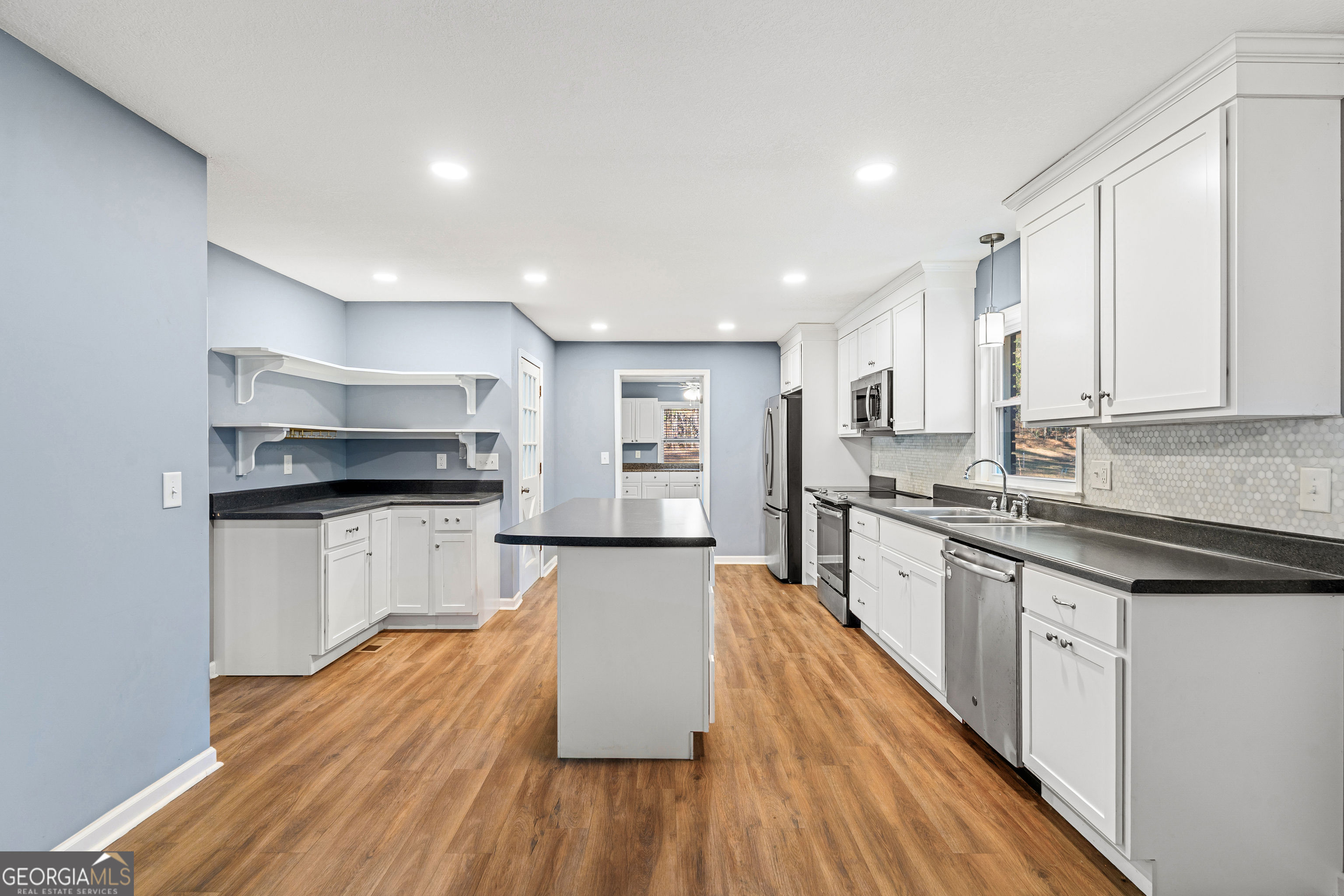 101 Fisher Drive Hartwell, GA 30643 - Photo 2 of 48 a large kitchen with stainless steel appliances granite countertop a lot of counter space and wooden floors