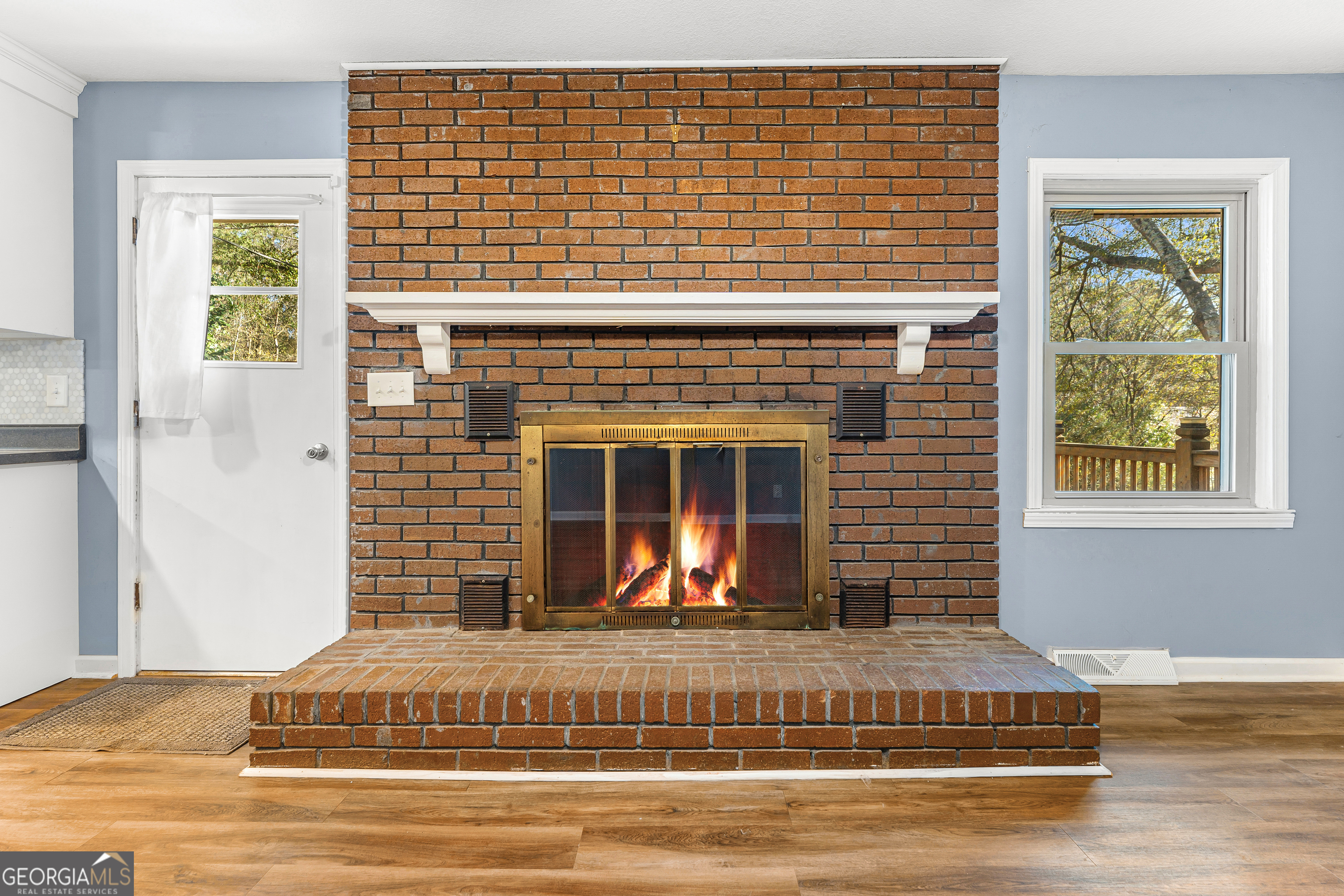 101 Fisher Drive Hartwell, GA 30643 - Photo 23 of 48 a view of a livingroom with a fireplace and windows