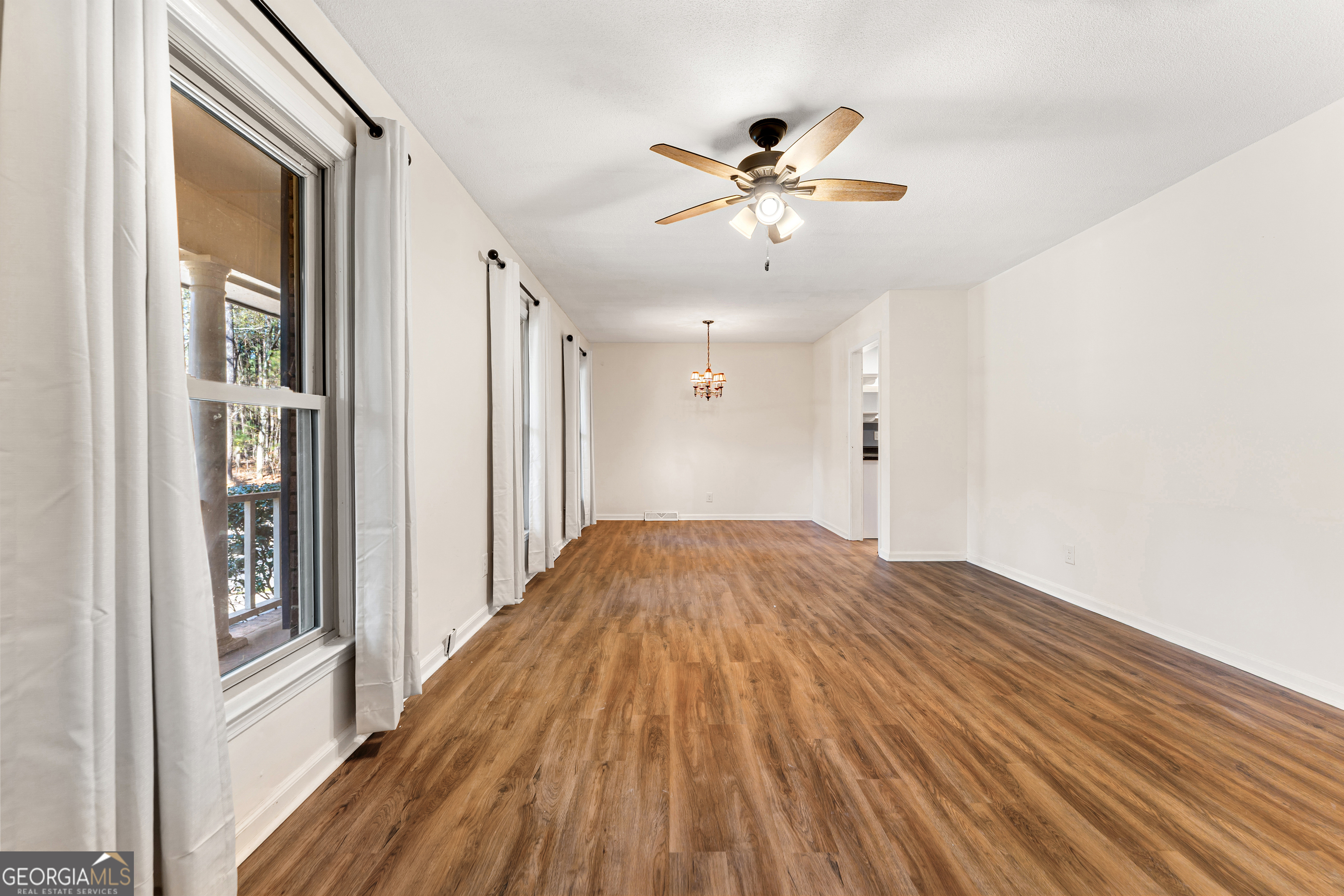 101 Fisher Drive Hartwell, GA 30643 - Photo 25 of 48 a view of a livingroom with wooden floor and closet area