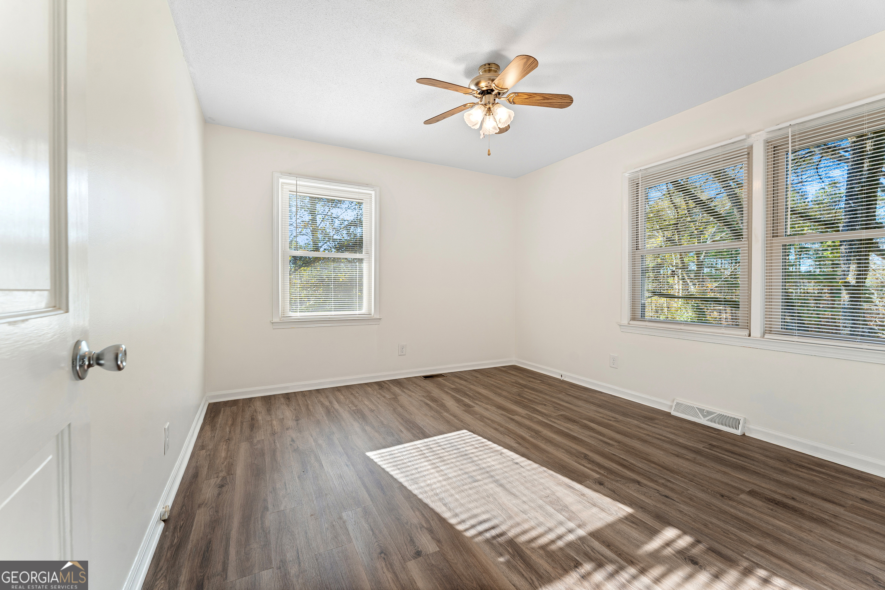 101 Fisher Drive Hartwell, GA 30643 - Photo 26 of 48 wooden floor in an empty room with a window