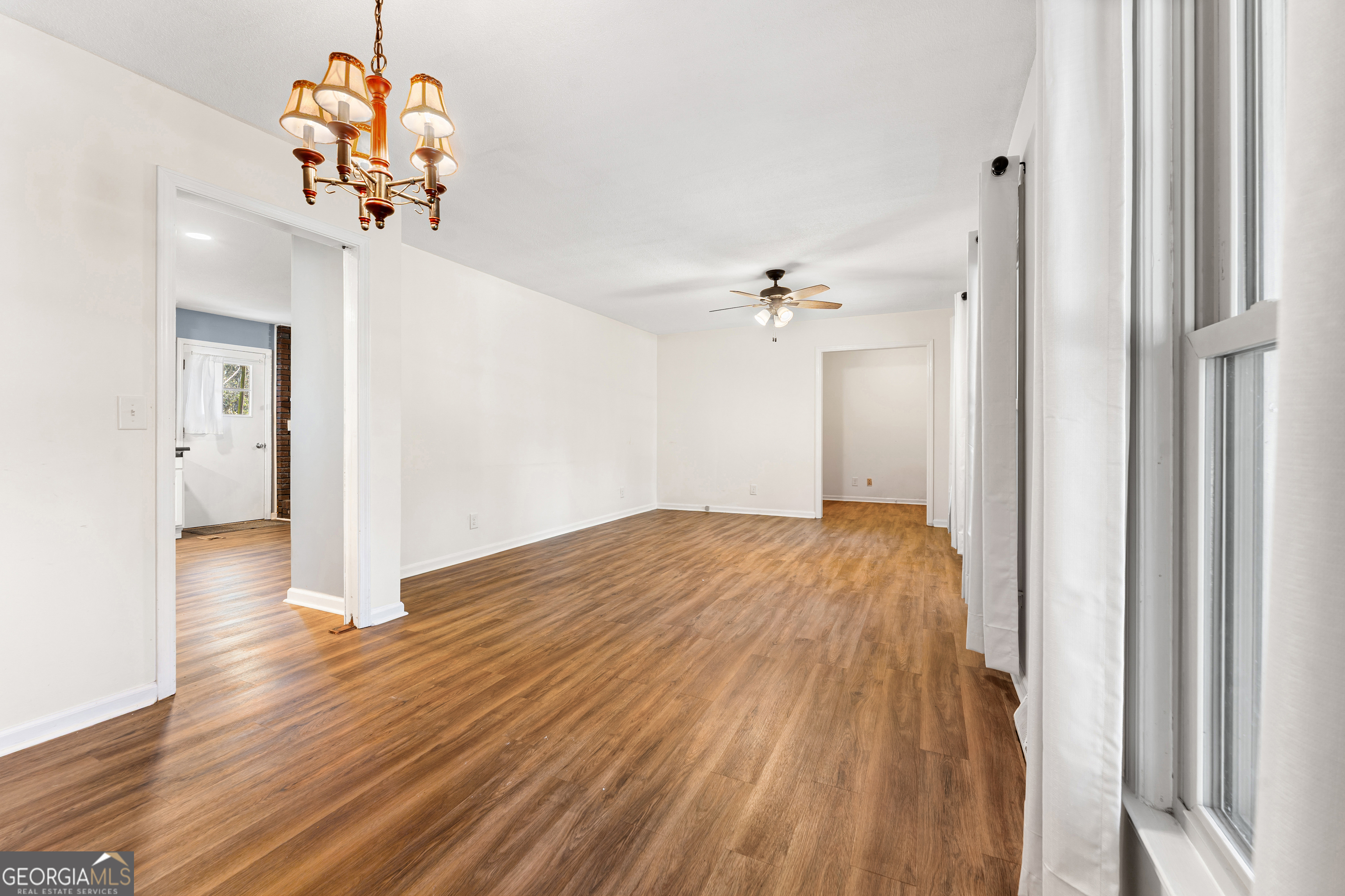 101 Fisher Drive Hartwell, GA 30643 - Photo 27 of 48 a view of a chandelier fan and wooden floor