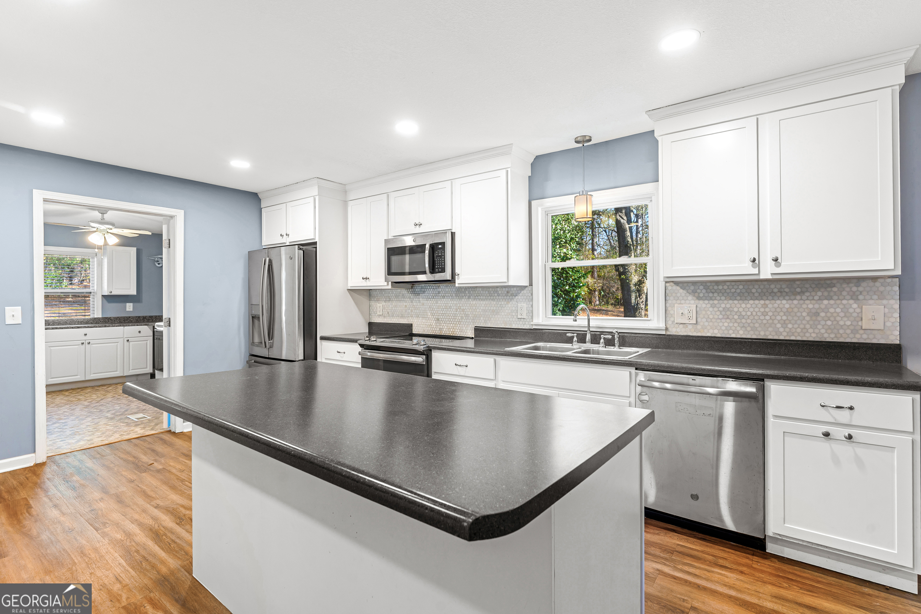 101 Fisher Drive Hartwell, GA 30643 - Photo 3 of 48 a kitchen with stainless steel appliances granite countertop a sink a stove and microwave