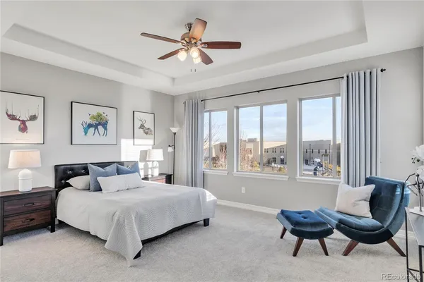 a bedroom with a large bed and a couch