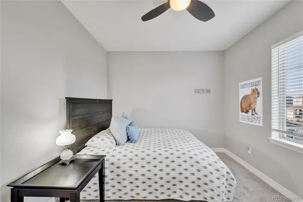 a bedroom with a bed and a desk
