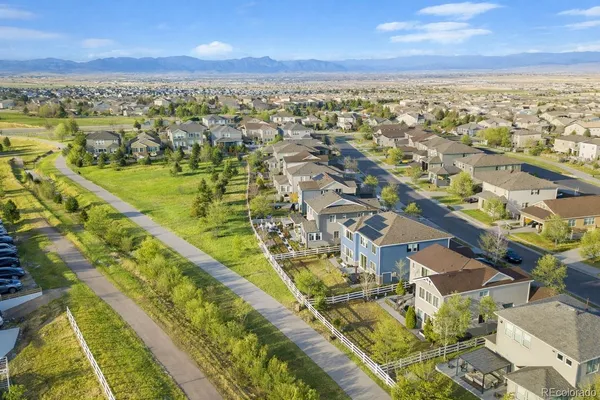 an aerial view of residential houses with outdoor space