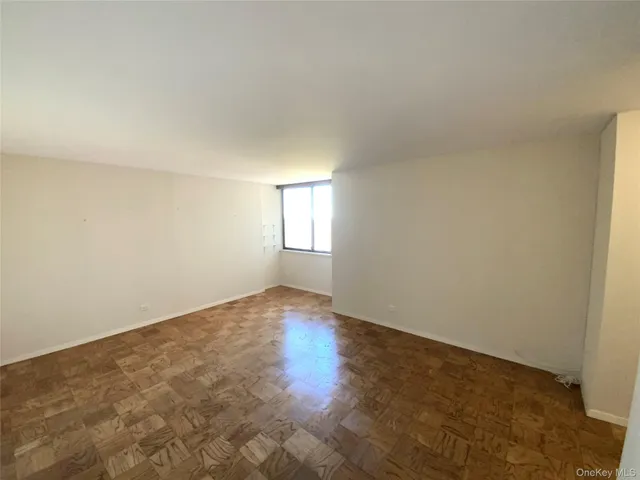 a bathroom with a granite countertop shower sink vanity and mirror