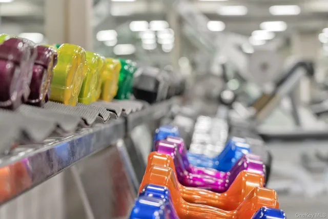 a view of a swimming pool with outdoor seating